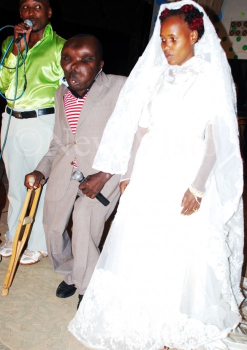Godfrey Baguma alias Ssebabi with his wife Kate Namanda during their wedding 