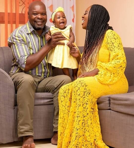 Abel Amunga with his daughter Ruth Matete and grandchild 
